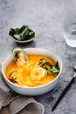 Creamy coconut soup with prawns and mussels